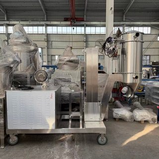 Proper Cleaning of Conveyor Parts An operator wearing gloves carefully cleaning parts of a disassembled vacuum conveyor.