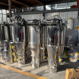 Vacuum Conveyor for Product Purity A clean, stainless steel vacuum conveyor system in a modern factory setting.